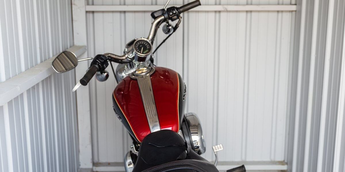 Motorbike inside a corrugated metal shed